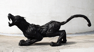 Illustration for article titled This Artist Turns Old Tires Into Dark, Disturbing Nightmare Monsters